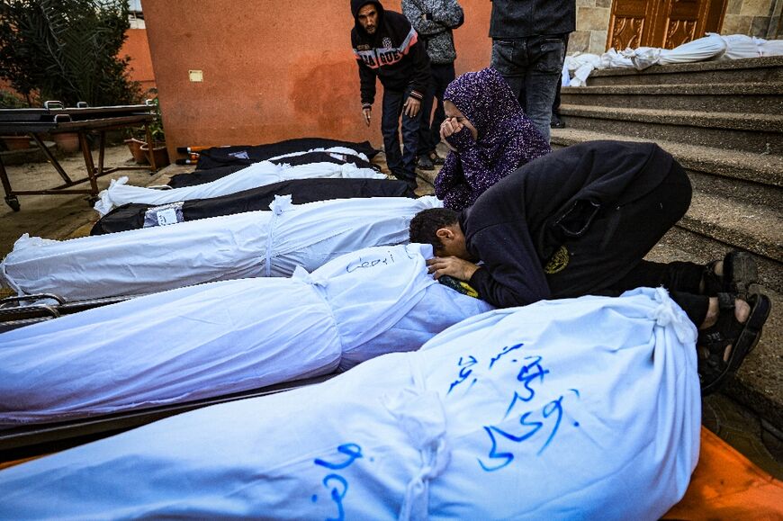 Relatives mourn people killed by Israeli bombardment at the morgue of the Nasser medical centre in Khan Yunis in the southern Gaza Strip, on January 4, 2024
