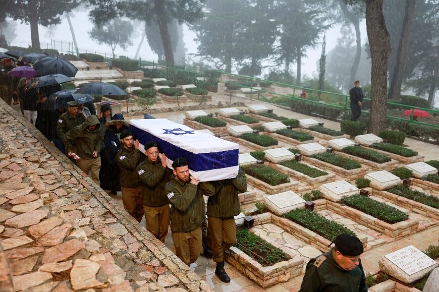 Israeli troops carry the coffin of a soldier killed in combat in Gaza