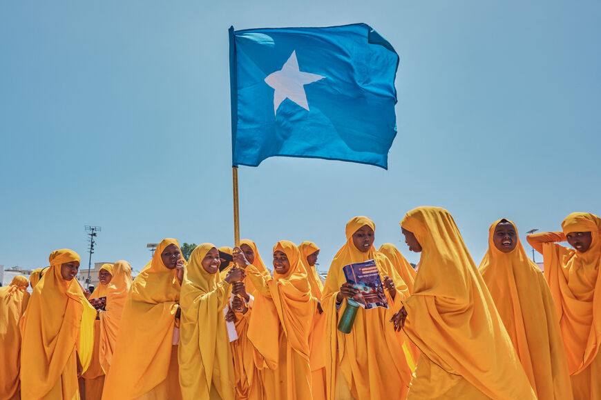 Students wave a Somali flag during a demonstration in support of Somalia's government following the port deal signed between Ethiopia and the breakaway region of Somaliland at Eng Yariisow Stadium in Mogadishu on January 3, 2024. Somalia vowed to defend its territory after a controversial Red Sea access deal between Ethiopia and the breakaway state of Somaliland that it branded as "aggression". (Photo by ABDISHUKRI HAYBE / AFP) (Photo by ABDISHUKRI HAYBE/AFP via Getty Images)