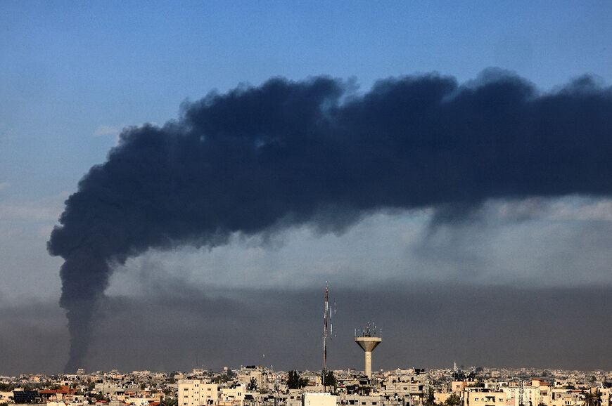 Seen from Rafah, smoke billows over Khan Yunis in the southern Gaza Strip during Israeli bombardment 