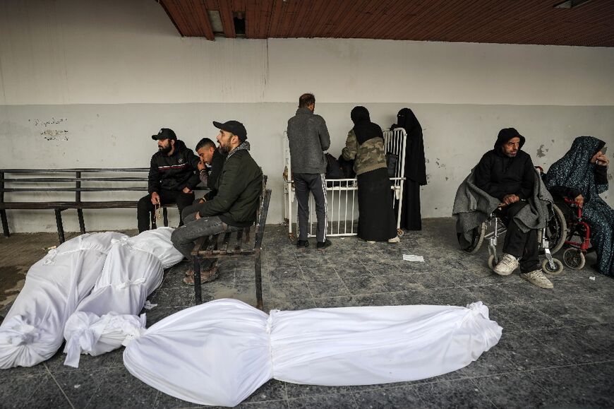 In Gaza City, bodies shrouded in white cloth were laid on a hospital floor and carried on donkey carts ahead of burial