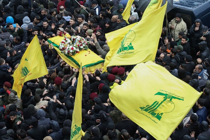 Hezbollah militants and supporters attend the funeral of military commander Ali al-Debs killed in an Israeli strike