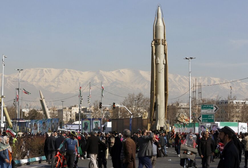 An Iranian Sejil surface-to-surface missile is displayed in Tehran as people gather to mark the 45th anniversary of the Islamic revolution 
