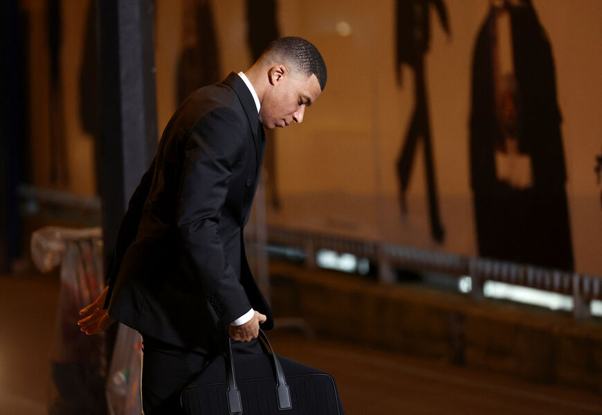 TOPSHOT - Paris Saint-Germain's French forward Kylian Mbappe arrives at the stadium prior to the UEFA Champions League round of 16 first leg football match between Paris Saint-Germain (PSG) and Real Sociedad at the Parc des Princes Stadium in Paris, on February 14, 2024. Kylian Mbappe told PSG directors he plans to leave the club, a source close to the club told AFP on February 15, 2024. (Photo by FRANCK FIFE / AFP) (Photo by FRANCK FIFE/AFP via Getty Images)