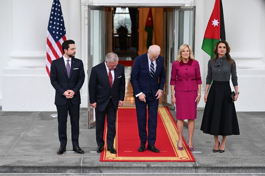 Crown Prince Al Hussein bin Abdullah II, King Abdullah II of Jordan, US President Joe Biden, US First Lady Jill Biden and Queen Rania Al Abdullah get into position for photos during an arrival ceremony at the White House