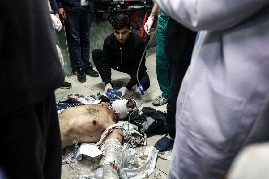 Inside the hospital in Rafah, medics treated wounded men who were laid out on the floor 
