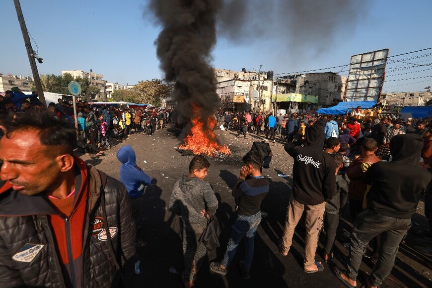 Palestinians burn tires in protest against the rising prices of food and supplies, in Gaza's Rafah refugee camp