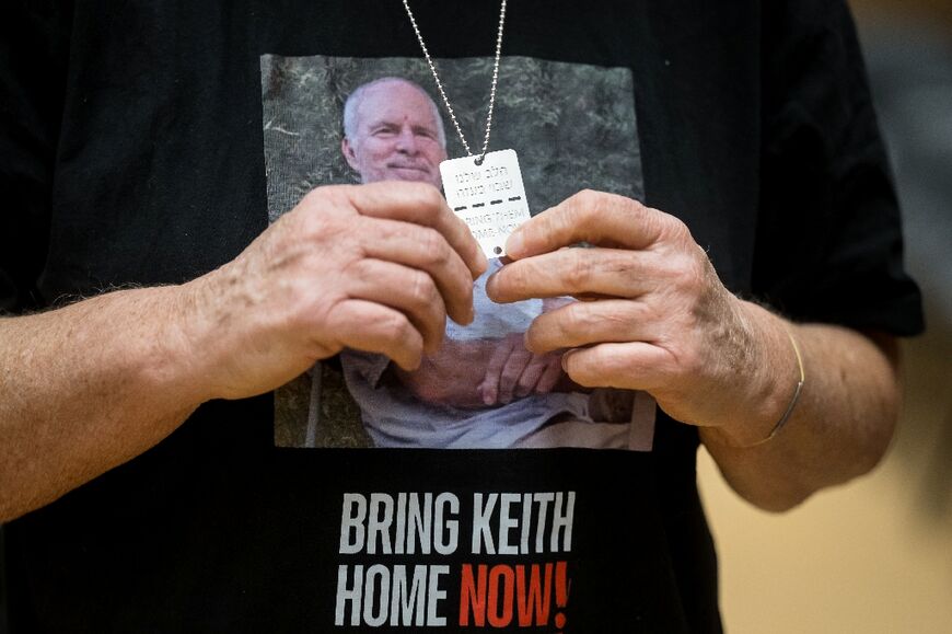 Israeli former hostage Aviva Siegel wore a T-shirt showing a picture of her husband Keith Siegel, taken three weeks before their abduction
