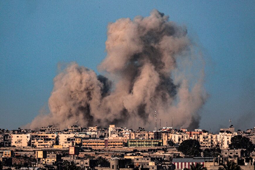 This picture taken from Rafah in the southern Gaza Strip shows smoke billowing during Israeli bombardment on Khan Yunis on February 22, 2024