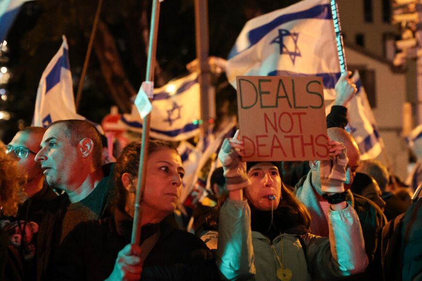 Opponents of the Israeli government's conduct of the war in Gaza, among them former hostages, demonstrate in Tel Aviv