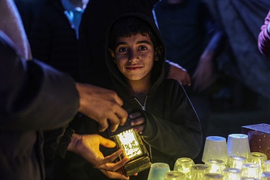 The iconic fanous lanterns are among the scarce signs that Ramadan is arriving in the war-battered Palestinian territory