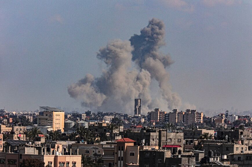 Smoke billows over Khan Yunis in the southern Gaza Strip during Israeli bombardment on March 11, 2024