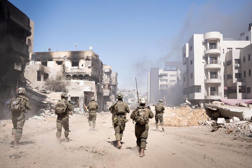 This handout picture released by the Israeli army on March 27, 2024 shows troops on the ground in the Gaza Strip, amid ongoing battles between Israel and the Palestinian militant group Hamas