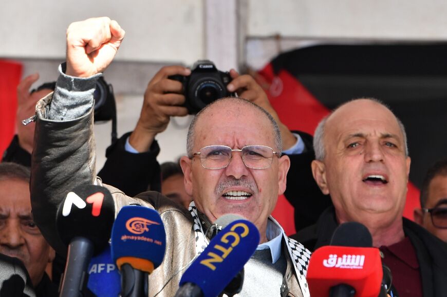 The head of the Tunisian General Labour Union UGTT, Noureddine Taboubi, speaks during the protest