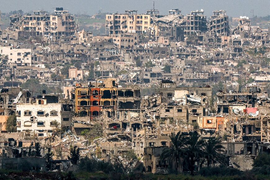 This picture taken from Israel's southern border with the Gaza Strip shows a view of destroyed buildings in the Palestinian territory following bombardments