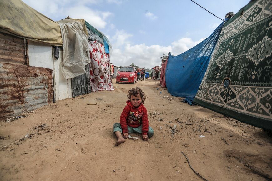 A child in a makeshift camp for displaced Palestinians in Deir al-Balah in central Gaza 