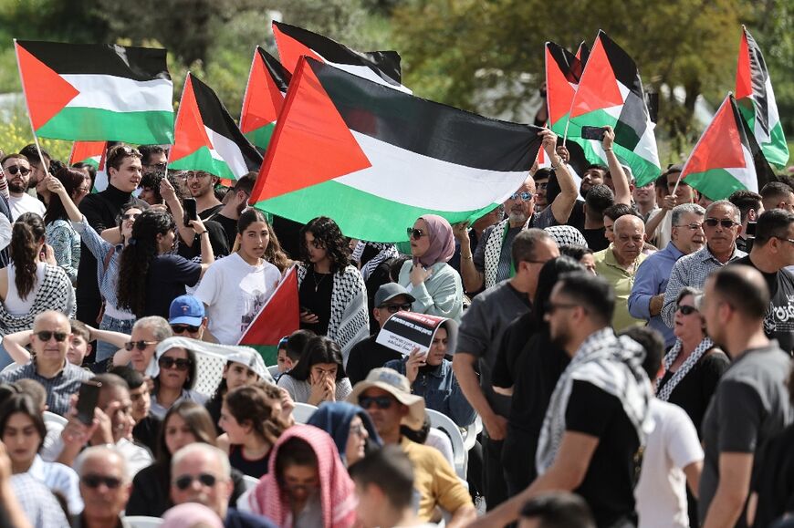 Arab citizens of Israel wave Palestinian flags as they demonstrate for an end to the Gaza war at the annual Land Day protest, this year in northern Israel