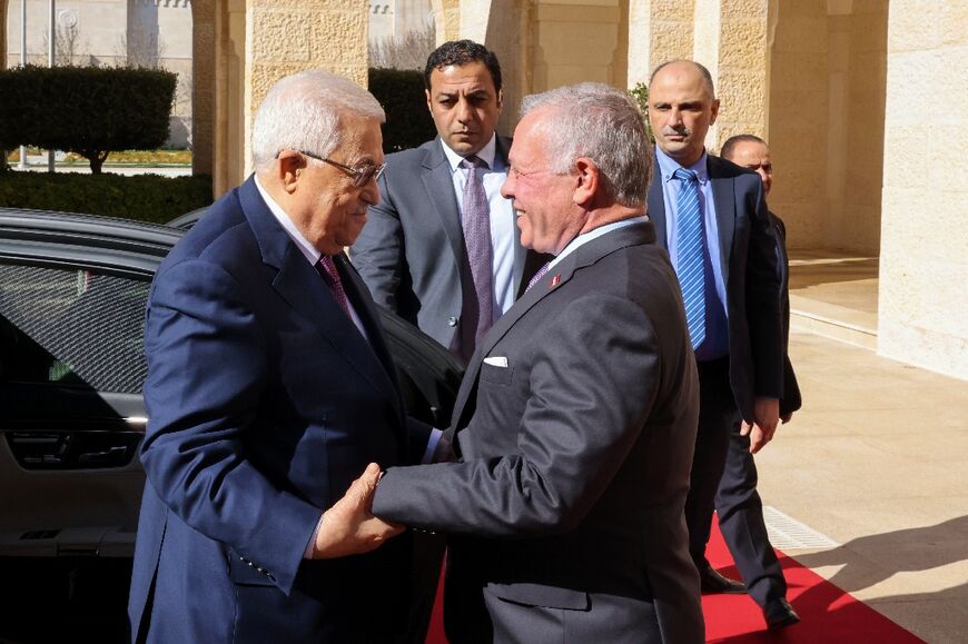 Jordan's King Abdullah II, on the right, welcomes Palestinian president Mahmud Abbas during a visit to Amman on February 25, 2024