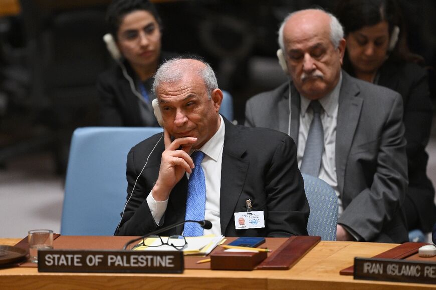 (L-R) Ziad Abu-Amr, member of the Palestinian Legislative Council, and Palestinian Ambassador to the UN Riyad Mansour listen during a United Nations Security Council meeting on the situation in the Middle East