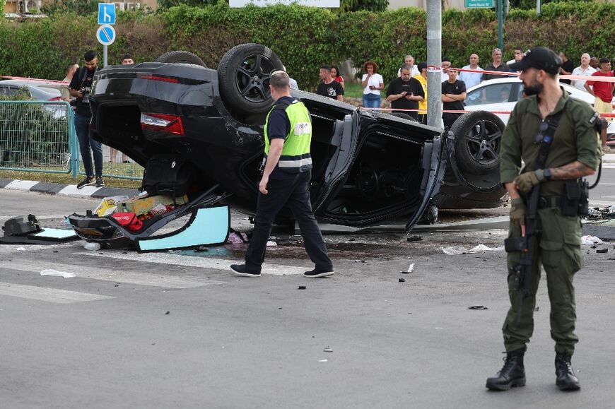 A flipped car after a crash involving Israel's far-right National Security Minister Itamar Ben Gvir