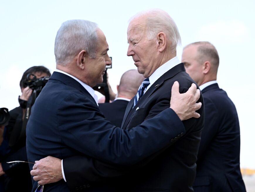 (FILES) Israel Prime Minister Benjamin Netanyahu (L) greets US President Joe Biden upon his arrival at Tel Aviv's Ben Gurion airport on October 18, 2023, amid the ongoing battles between Israel and the Palestinian group Hamas.
  
 Biden spoke by phone with Netanyahu April 4, 2024, the White House said, amid growing outrage over an Israeli strike that killed seven aid workers in Gaza.