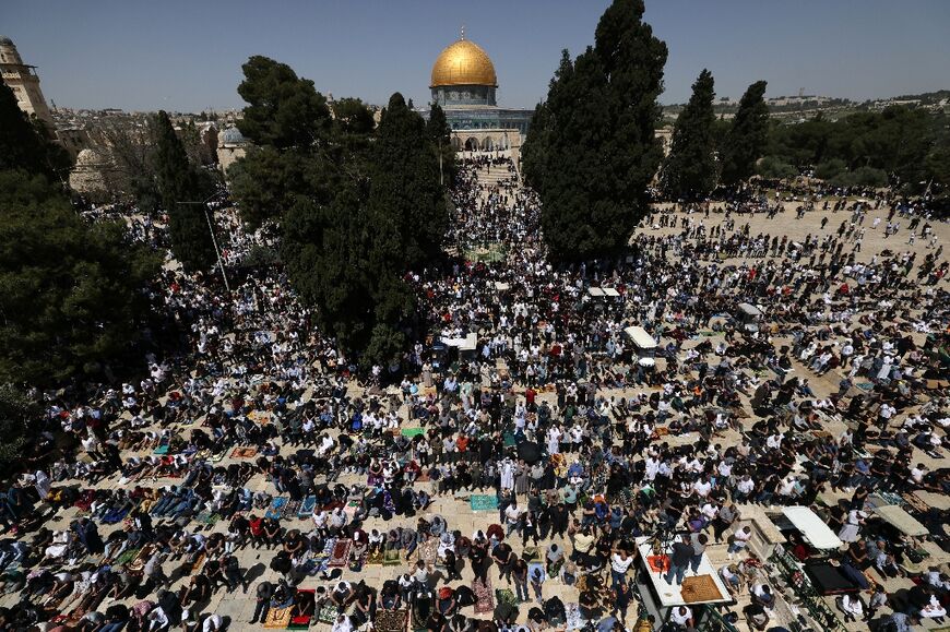 Palestinians perform the last Friday noon prayer of Islam's holy fasting month of Ramadan at the Al-Aqsa mosque compound in Jerusalem on April 5, 2024