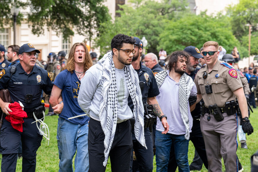 Three people are detained by police as pro-Palestinian students protest the Israel-Hamas war on the campus of the University of Texas in Austin, Texas, on April 24, 2024. Universities have become the focus of intense cultural debate in the United States since the October 7 Hamas attack and Israel's overwhelming military response to it. (Photo by SUZANNE CORDEIRO / AFP) (Photo by SUZANNE CORDEIRO/AFP via Getty Images)