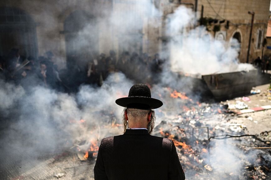 Ultra-Orthodox Jews burn leavened items in Jerusalem during preparations for the start of the Passover holiday