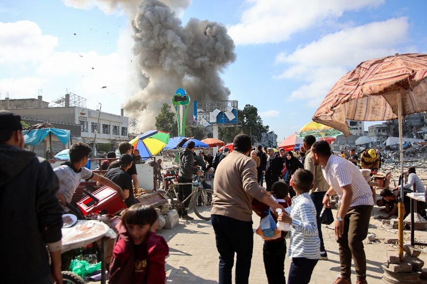 Smoke billows during Israeli bombardment of the Firas market area