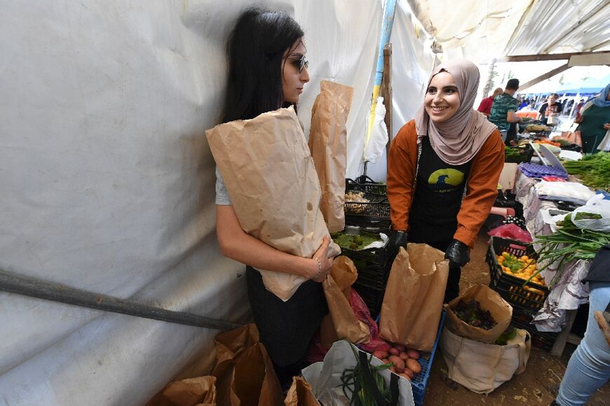 Preparing bags of their  produce for Friday market customers