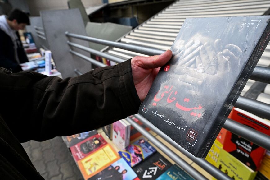 Clients browse publications, including a novel reportedly banned under Assad