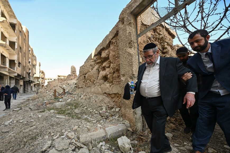 Syrian American Rabbi Youssef Hamra visits the ruins of the Eliyahu Hanavi synagogue in the heavily war-damaged Damascus suburb of Jobar.