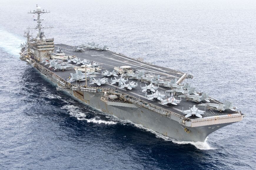 An image provided by the US Navy shows the USS Harry S. Truman aircraft carrier transiting the Strait of Gibraltar on November 25, 2024