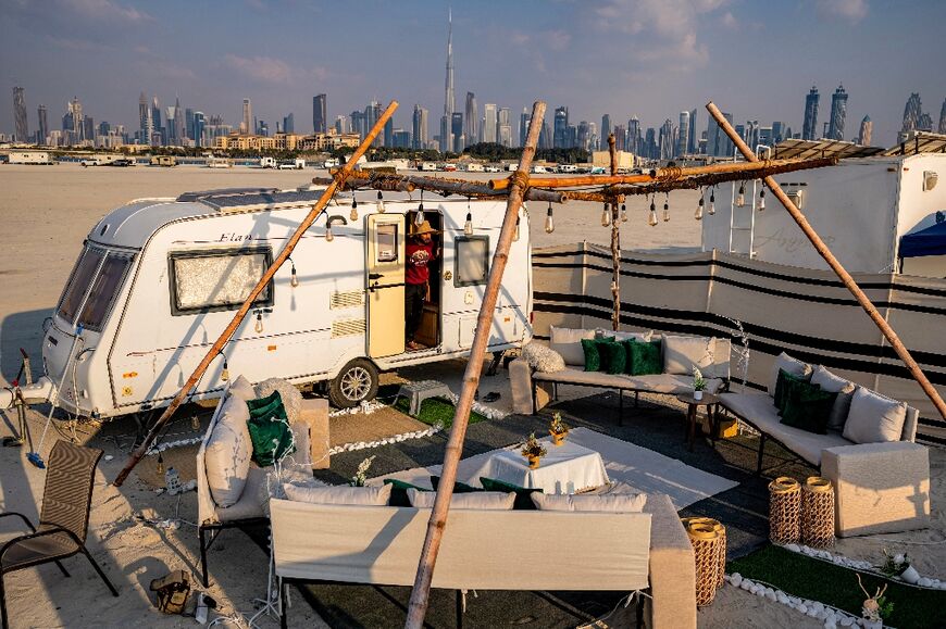 Visitors travelling with a camper van pass along the secret of the striking view of the Burj Khalifa