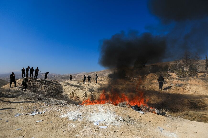 Seized captagon is burned in a field near the Fourth Division's Security Bureau on the edge of Damascus