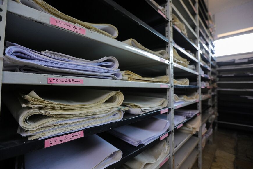 Documents in a room at the feared Fourth Divison's Security Bureau HQ on the edge of Damascus