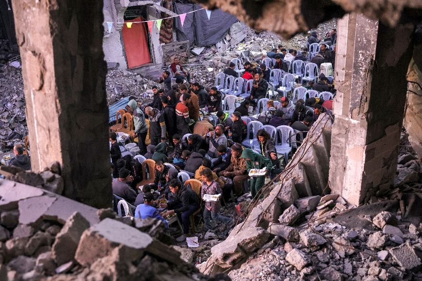 Dozens gathered amongst the rubble in Jabalia, in the northern Gaza Strip