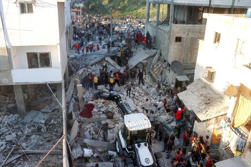 A SANA picture shows emergency workers at the site of the explosion