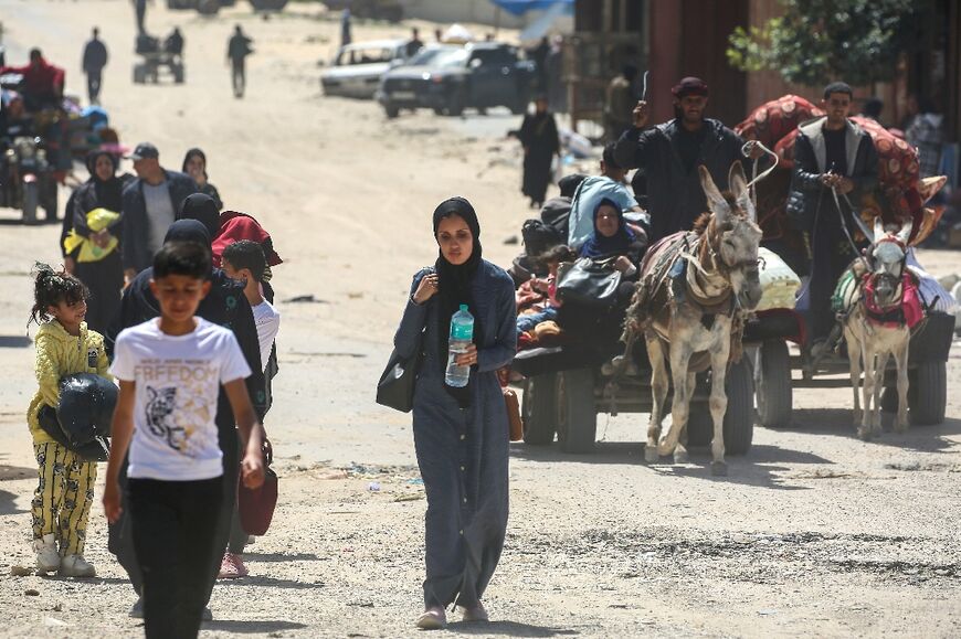 People fleeing Rafah arrive in nearby Khan Yunis following new Israeli evacuation orders on Monday