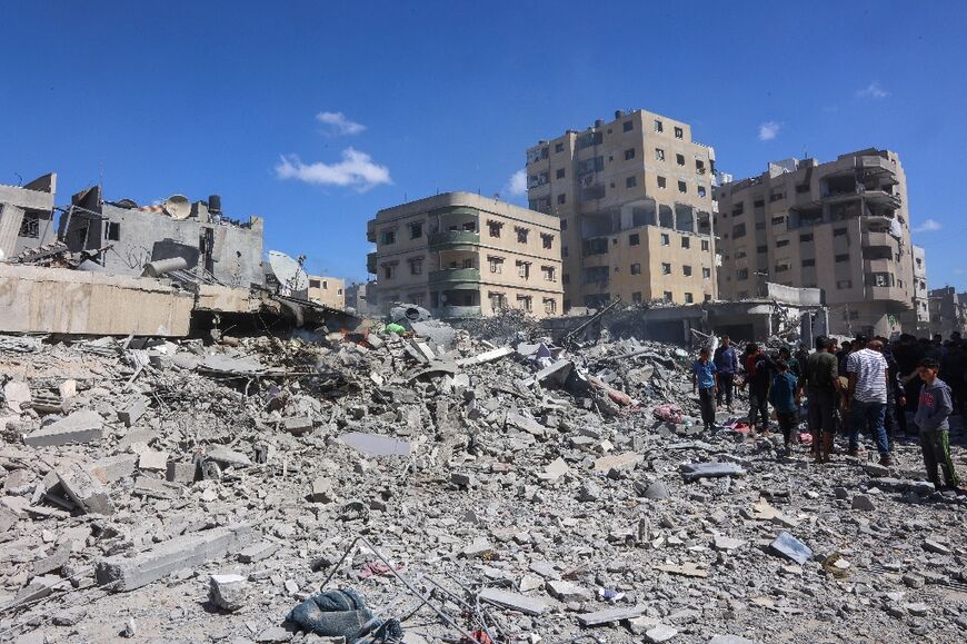 Gazans travelled to find shelter surrounded by bombed-out buildings, piles of rubble, and mountains of waste