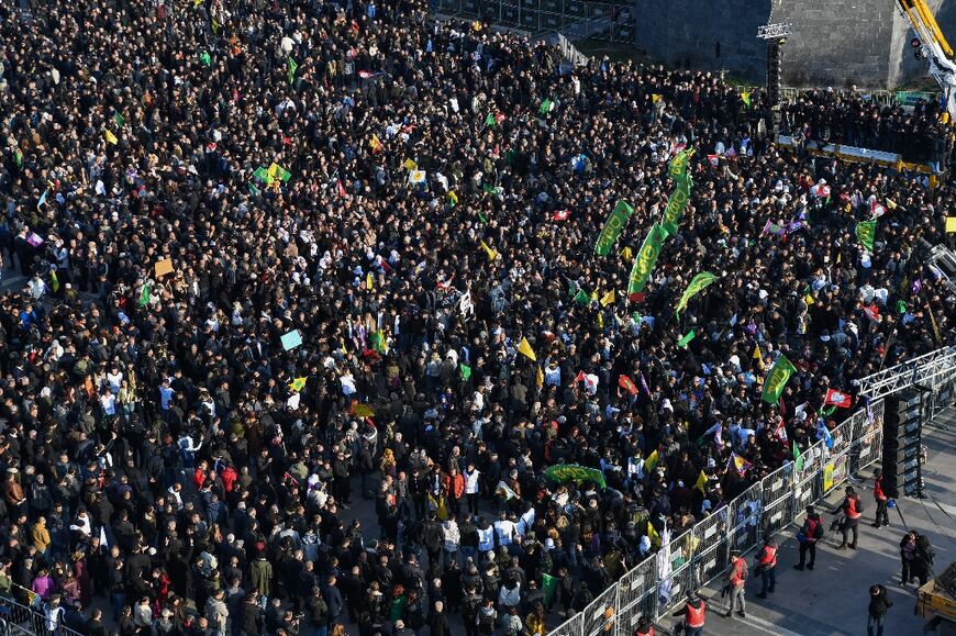 A large crowd in the Kurdish majority city of Diyarbakir listens to an appeal by jailed militant leader Abdullah Ocalan for PKK to lay down its weapons 