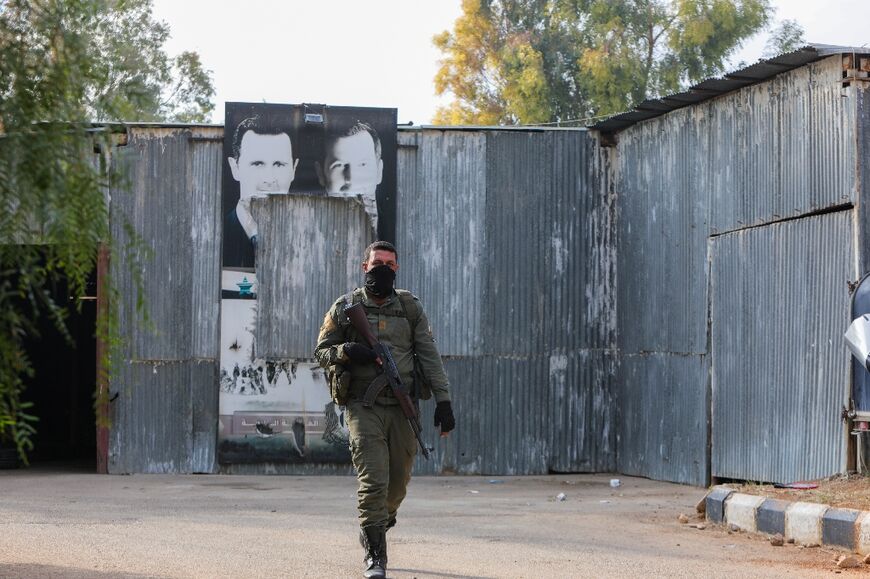 A member of the new Syrian security forces at a Fourth Division compound in the capital