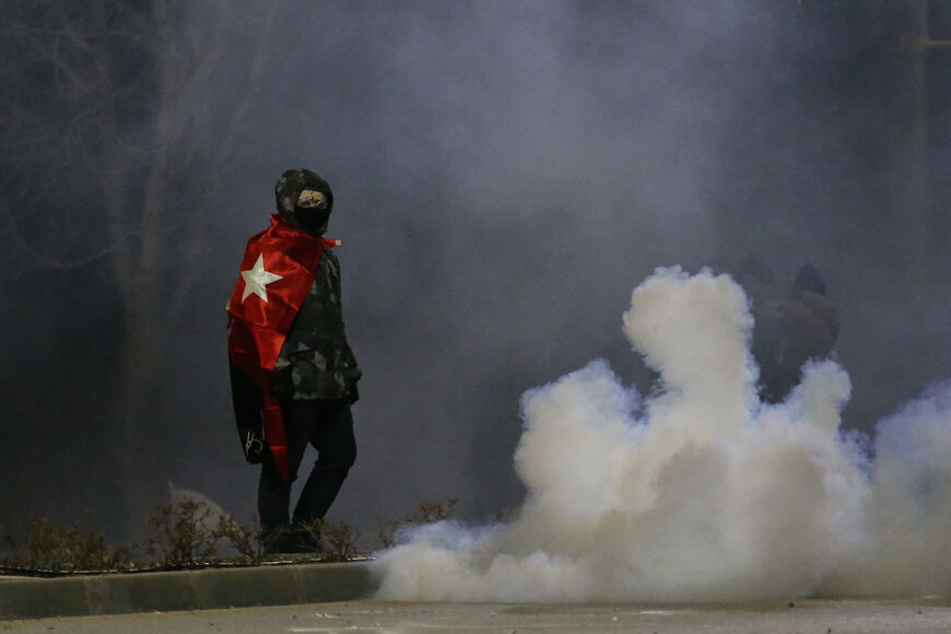 Middle East Technical University (ODTU) students clash with Turkish anti riot police as they use tear gas and water cannons to disperse protesters demonstrate against the arrest of Istanbul mayor, in Ankara on March 20, 2025. Turkish police detained Istanbul's powerful Mayor Ekrem Imamoglu on March 19, in connection with two investigations into graft and "supporting terror," a move that the main opposition party slammed as a politically-motivated "coup". (Photo by Adem ALTAN / AFP) (Photo by ADEM ALTAN/AFP 