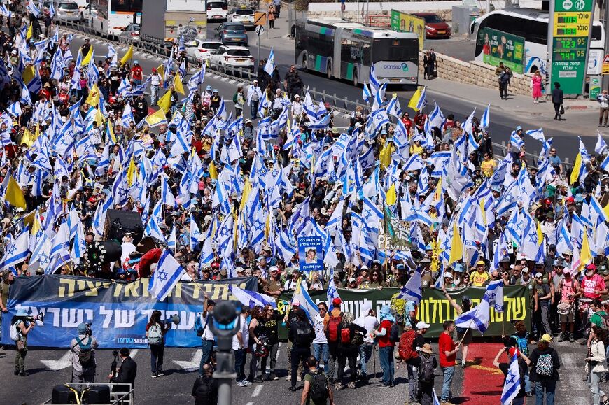 A tense police force manned makeshift barricades around the protest, which grew throughout the day