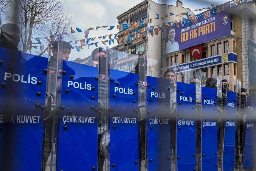 Police officers beef up security around provincial police headquarters where Istanbul Mayor Ekrem Imamoglu is being held