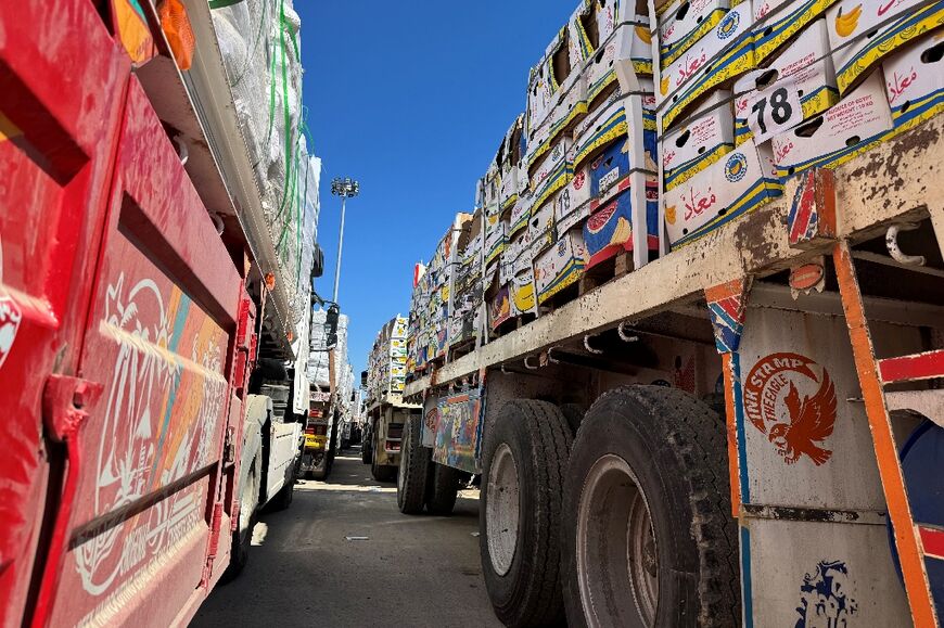 Trucks carrying humanitarian aid line up on the Egyptian side of the Rafah border crossing with the Gaza Strip after Israel suspended the entry of supplies into the Palestinian territory
