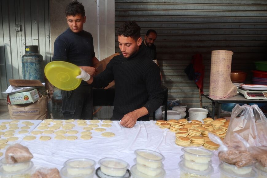 A Palestinian vendor cools down Qatayef, traditional pancakes made during the Muslim holy month of Ramadan