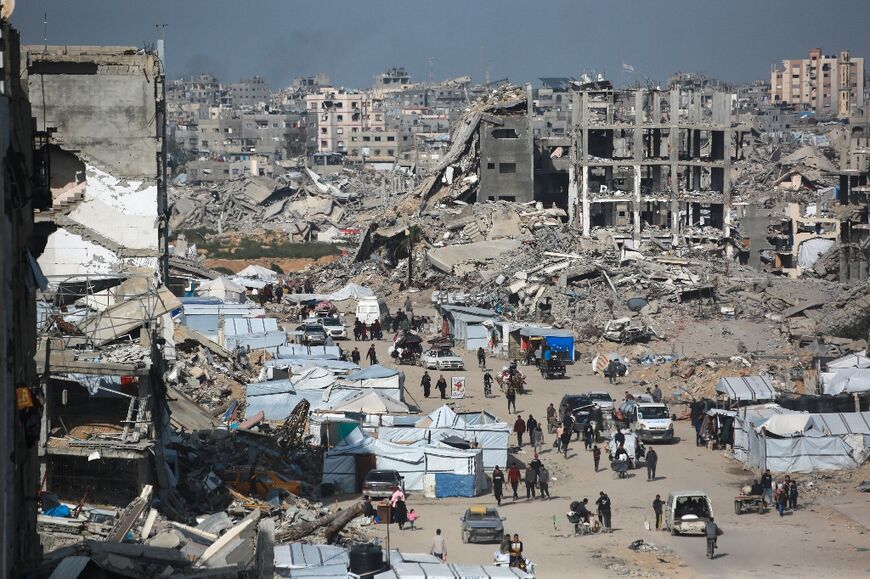 Palestinians flee Israeli bombardment in Beit Lahia in the northern Gaza Strip