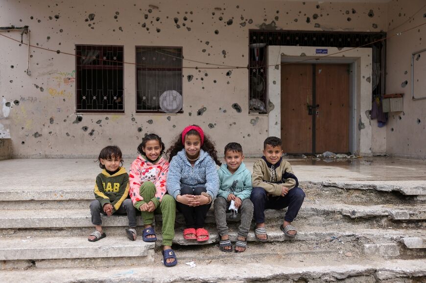 Palestinian orphans pose at the war-damaged Al-Amal orphanage in Gaza City -- the UN children's fund has estimated there were thousands of unaccompanied or separated children in Gaza
