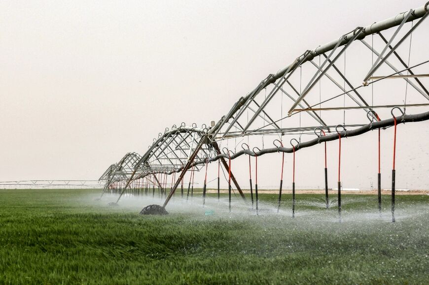 An irrigation system supplied by groundwater operates in a wheat field near Iraq's central city of Karbala 